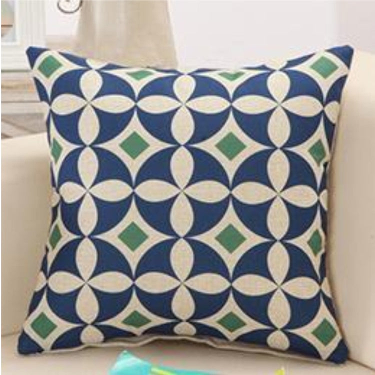 Navy cushion cover with a cream petal lattice pattern and teal accents.