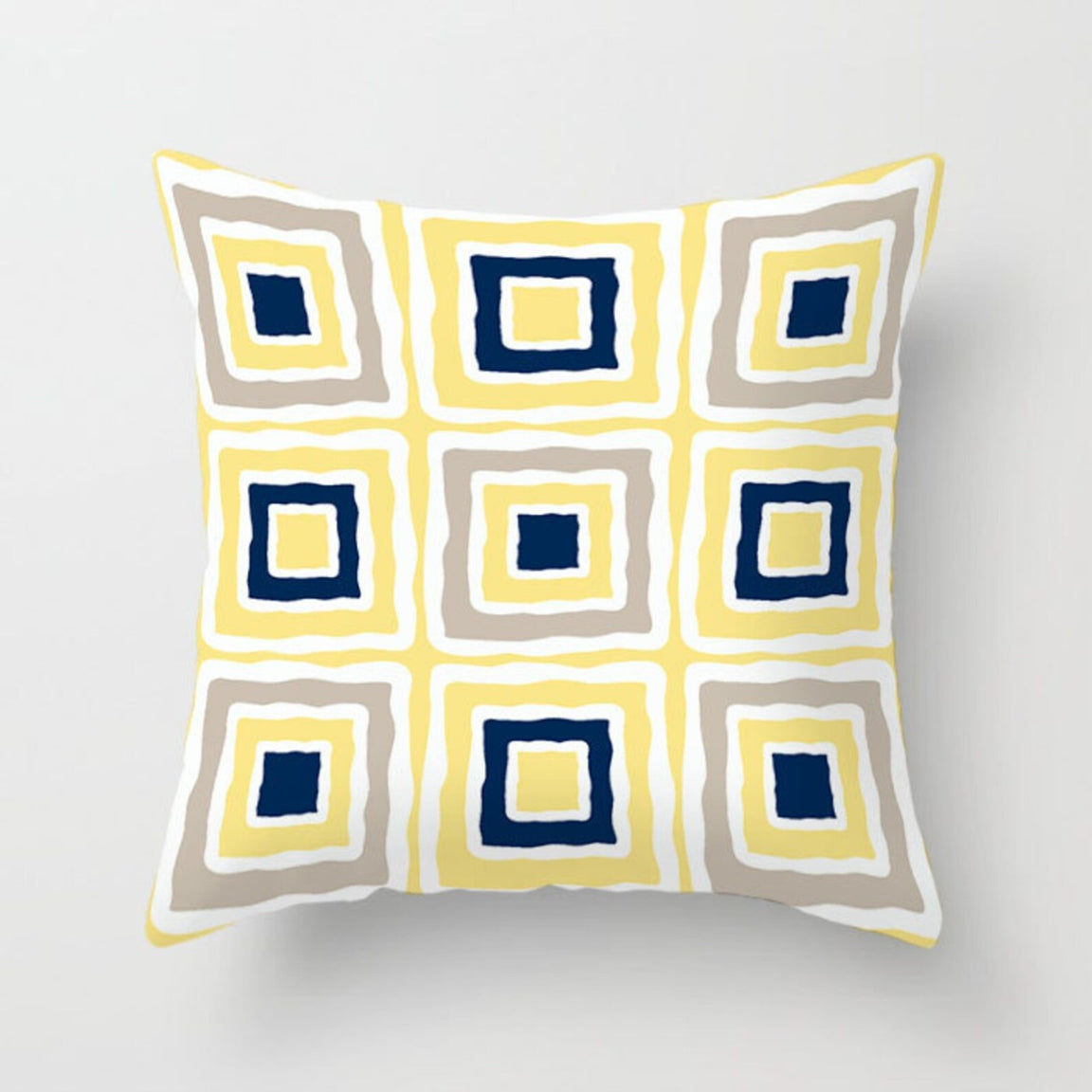 Cream cushion cover with yellow, grey and navy nested squares.