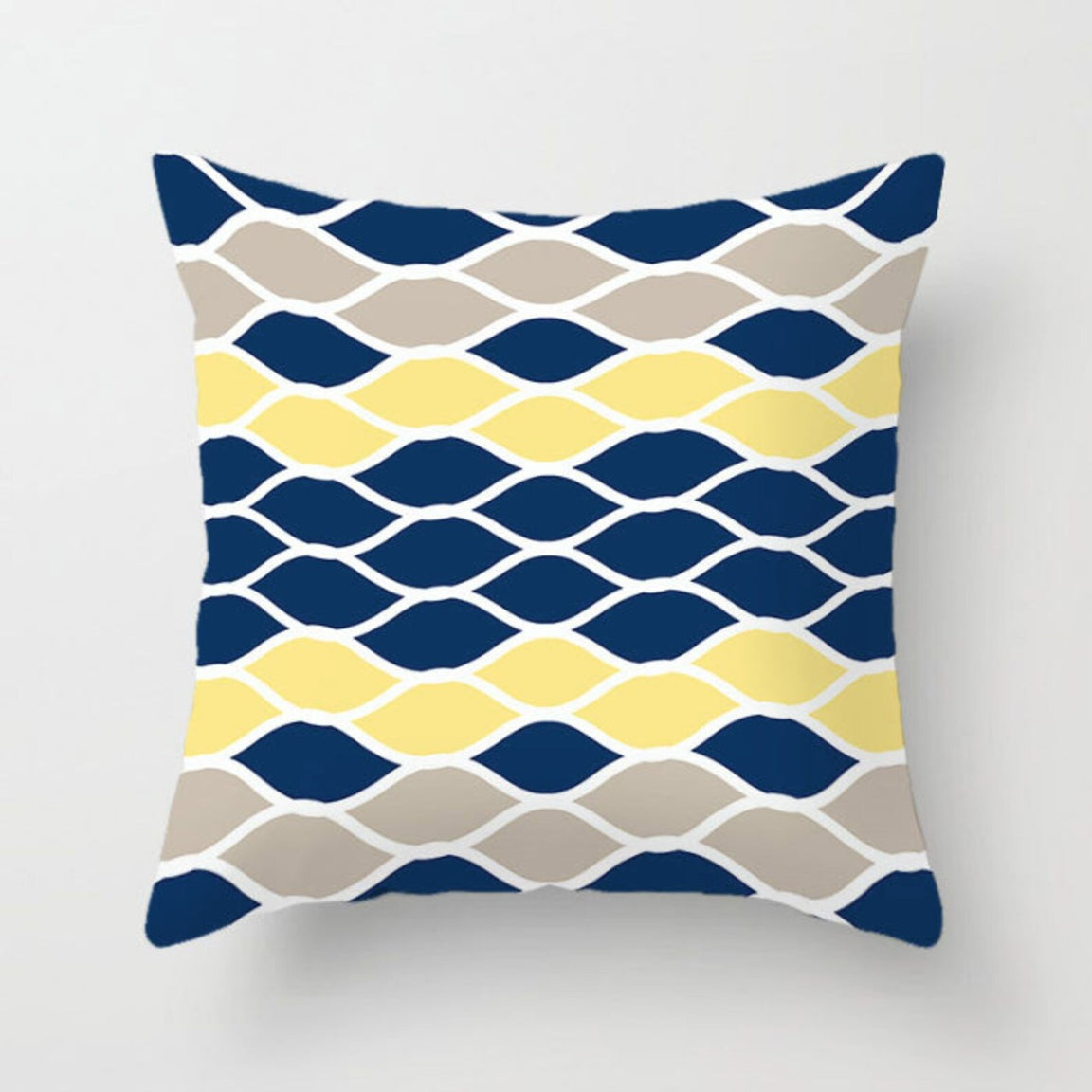 Cushion cover with rows of navy, yellow, grey and white linked oval shapes.