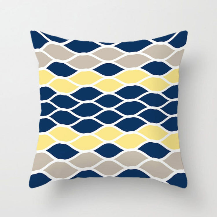 Cushion cover with rows of navy, yellow, grey and white linked oval shapes.