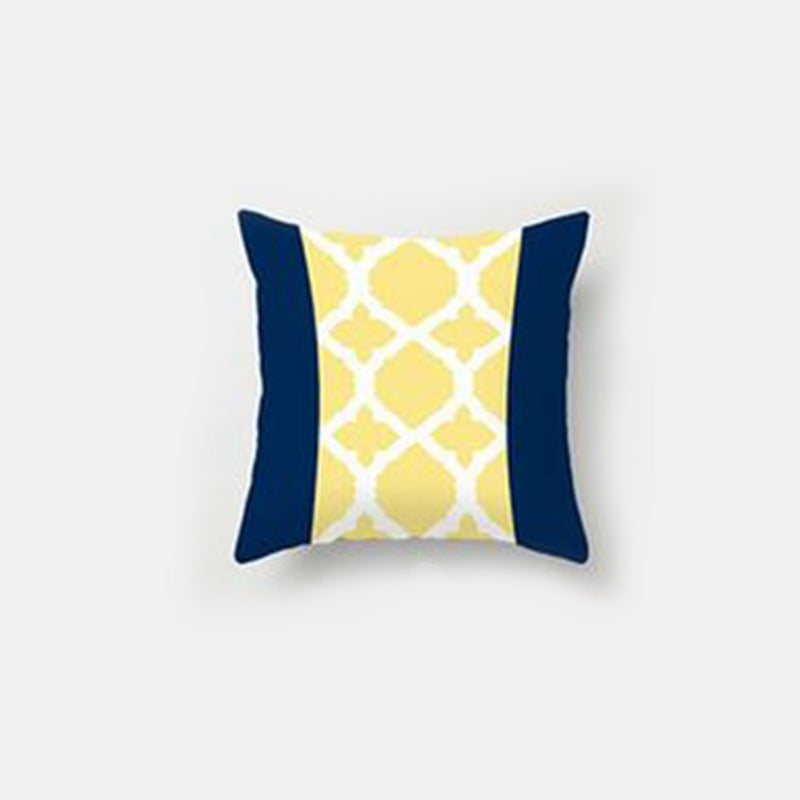 Cushion cover with navy side panels and a yellow and white lattice centre.