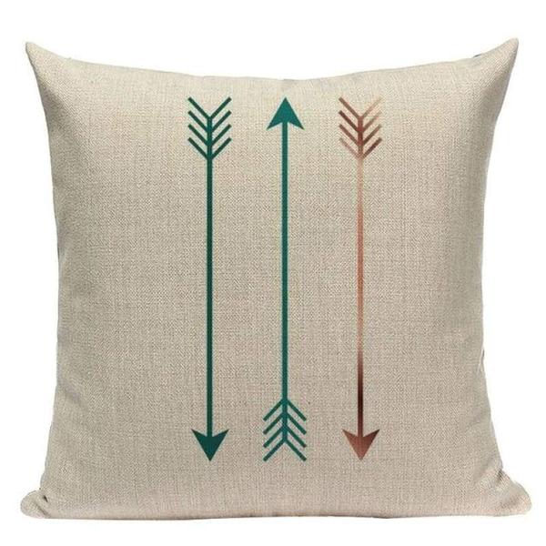 Cream cushion cover with three slim teal and rust arrows.
