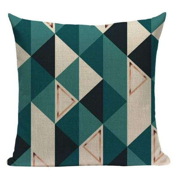 Cushion cover with teal, black and beige triangular patchwork shapes.