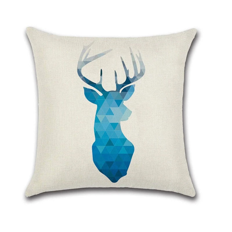 Cream cushion cover with a blue and teal geometric deer head.