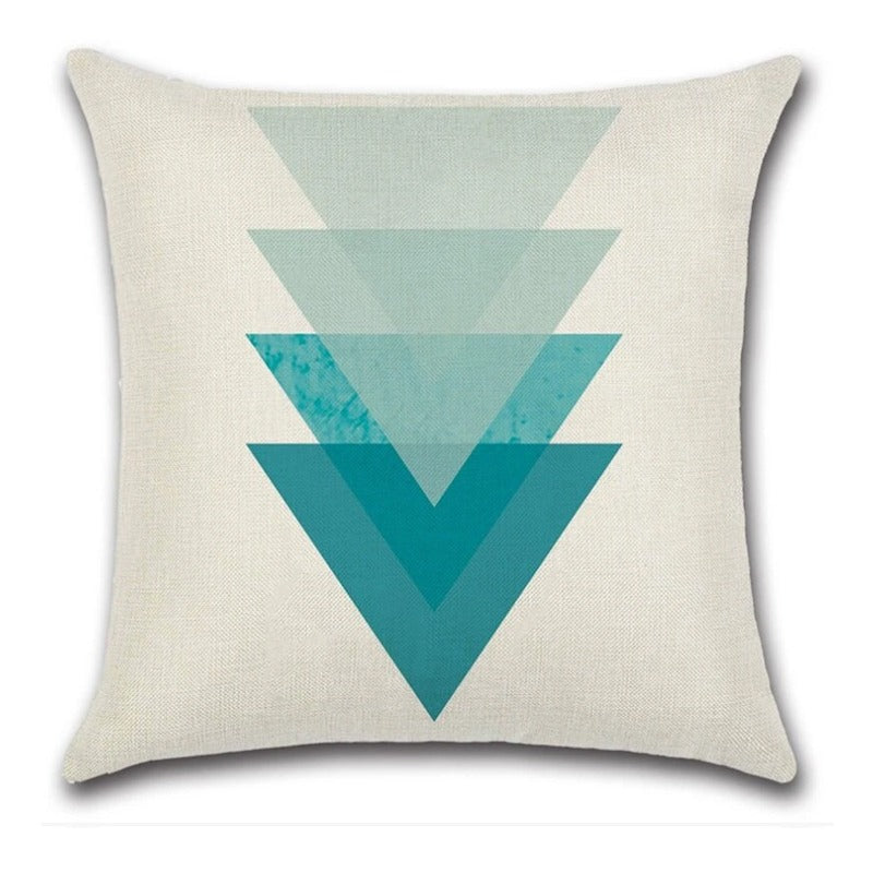 Cream cushion cover with overlapping downward triangles in shades of teal.