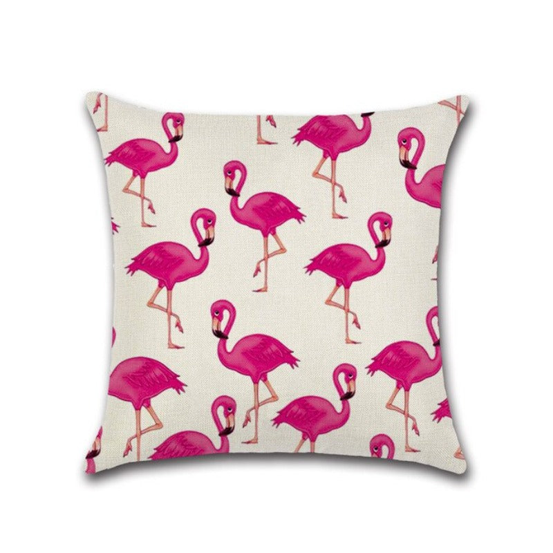 Cream cushion cover with a repeating pink flamingo print.