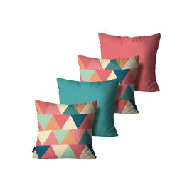 Four cushion covers with multicoloured triangles and plain teal and pink designs.