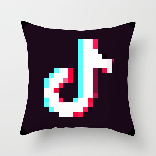 Black cushion cover with a pink, blue and white TikTok logo.