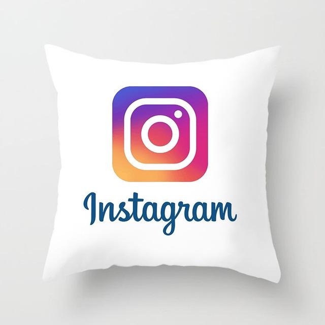 White cushion cover with a multicoloured Instagram logo and lettering.