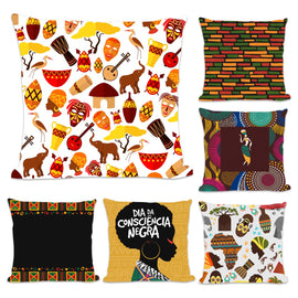 Six cushion covers with colourful figures, masks, drums and geometric designs.