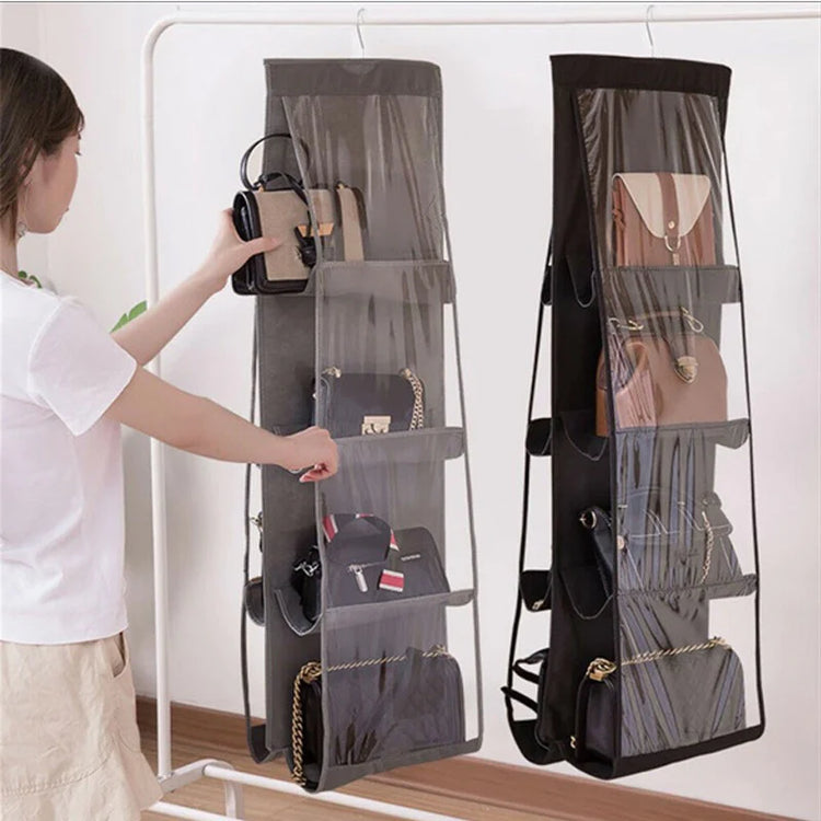 Hanging handbag organizers with clear pockets displayed on doors.
