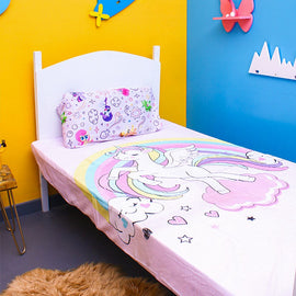 Pastel unicorn-print children's bedsheet and matching pillowcase on a single bed.