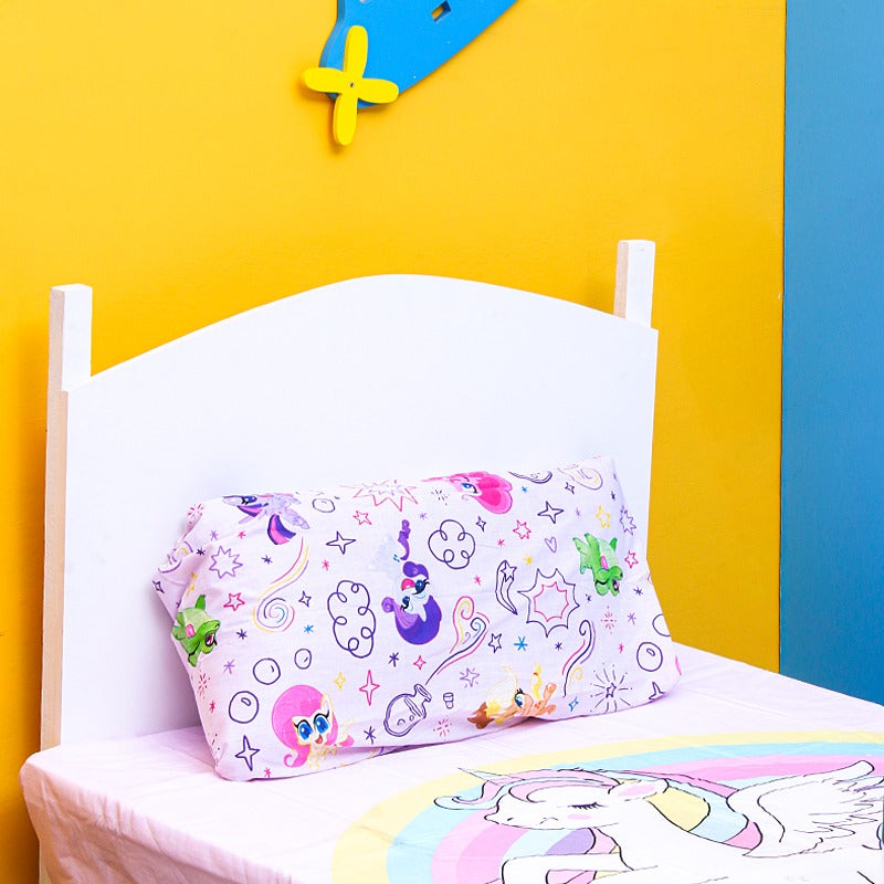 Close-up of a pastel-print pillowcase with a matching unicorn bedsheet.
