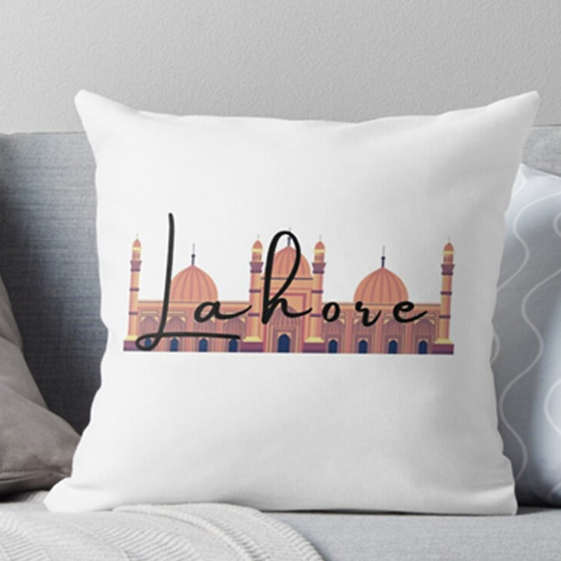 White cushion cover with Lahore lettering and an illustrated city skyline.