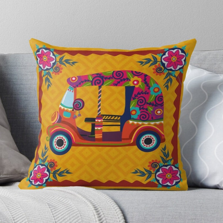 Yellow cushion cover with a colourful decorated rickshaw and floral border.