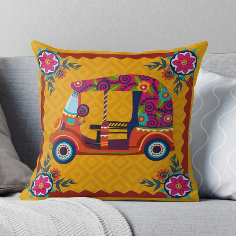 Yellow cushion cover with a colourful decorated rickshaw and floral border.
