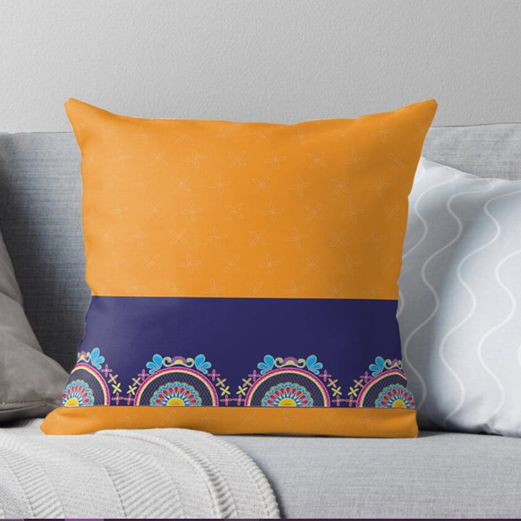 Mustard and navy cushion cover with a colourful decorative border.