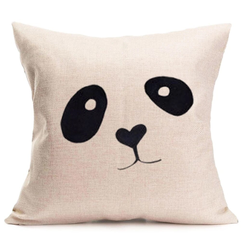 Cream cushion cover with a simple black panda face.