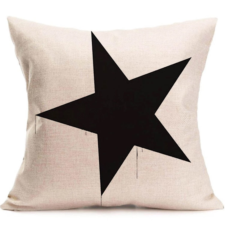 Cream cushion cover with a large black five-pointed star.