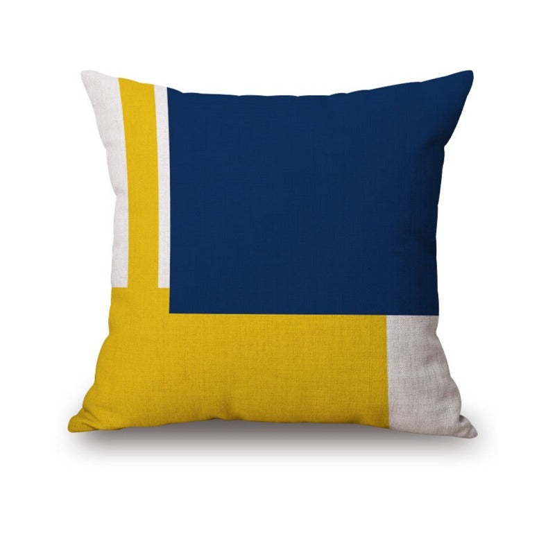 Cushion cover with large navy, yellow and white colour blocks.