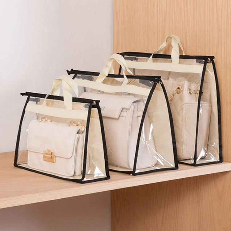 Three handbags stored in clear covers with black trim on a shelf.