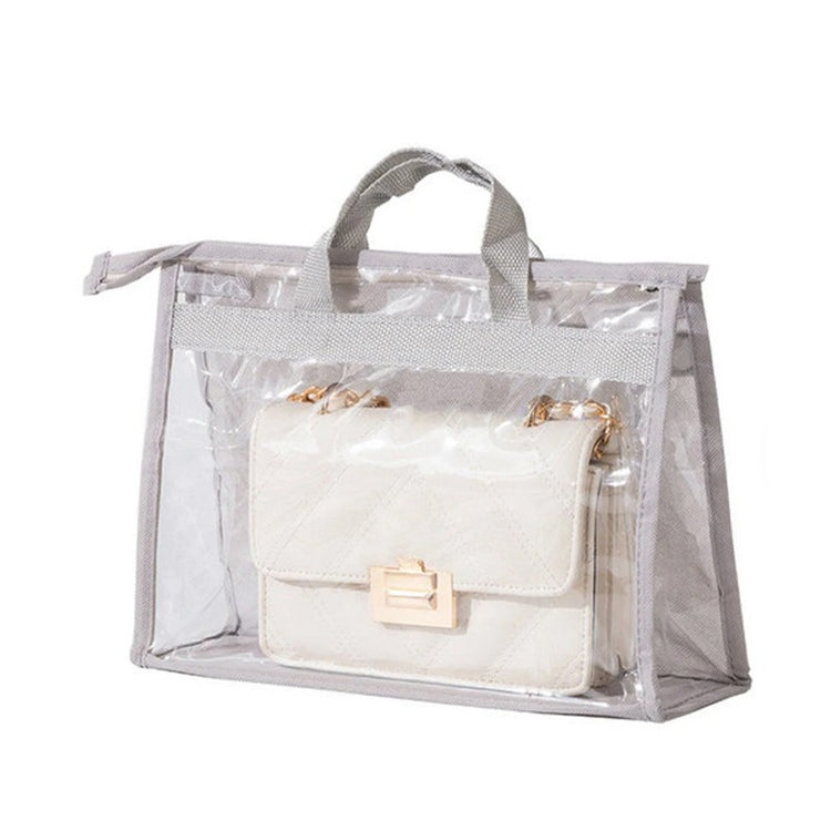 Clear handbag storage cover with grey trim and carrying handles.
