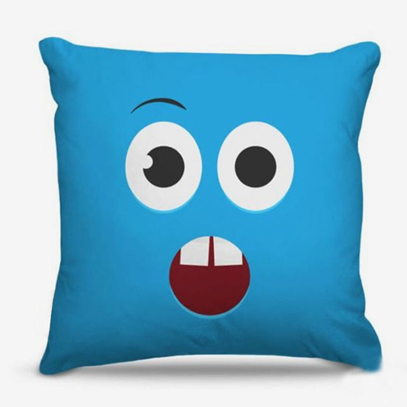 Blue cushion cover with a surprised cartoon face.