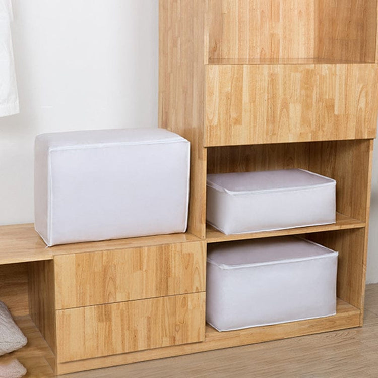White zippered storage cubes arranged on wardrobe shelves.