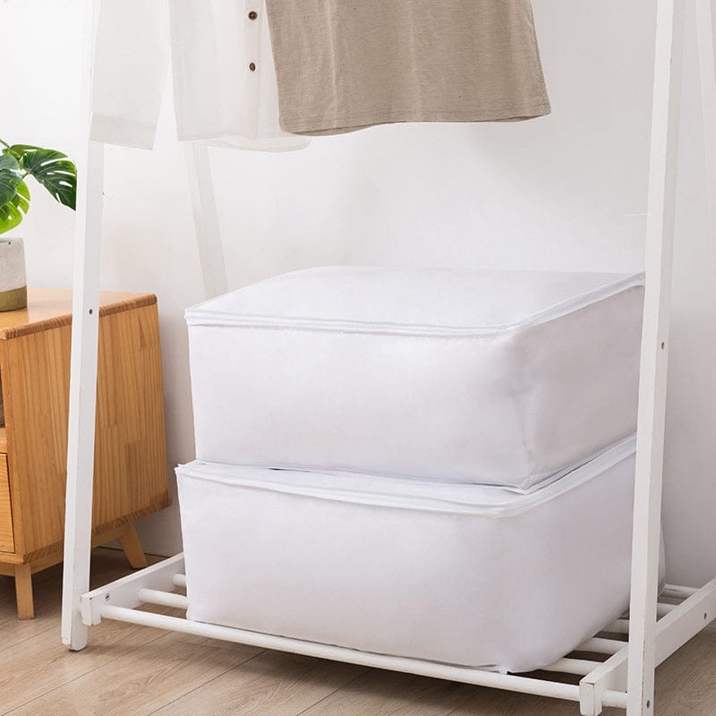 White fabric storage cubes beneath hanging clothes.