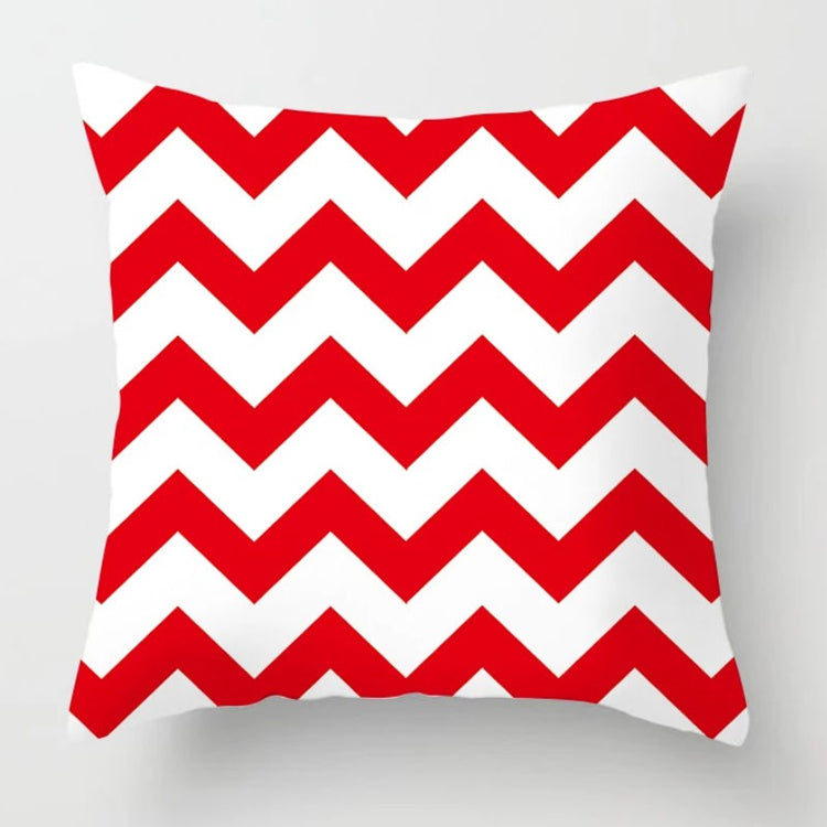 Cushion cover with bold red and white zigzag stripes.