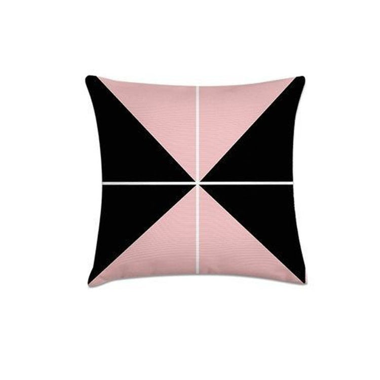 Cushion cover with four pink and black triangular sections meeting at the centre.