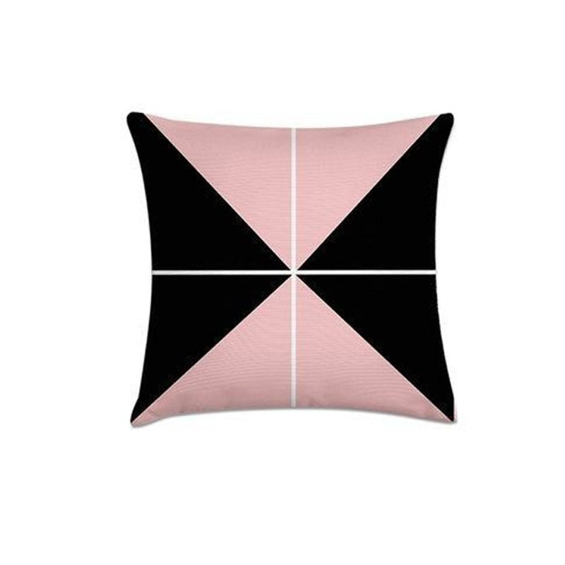 Cushion cover with four pink and black triangular sections meeting at the centre.