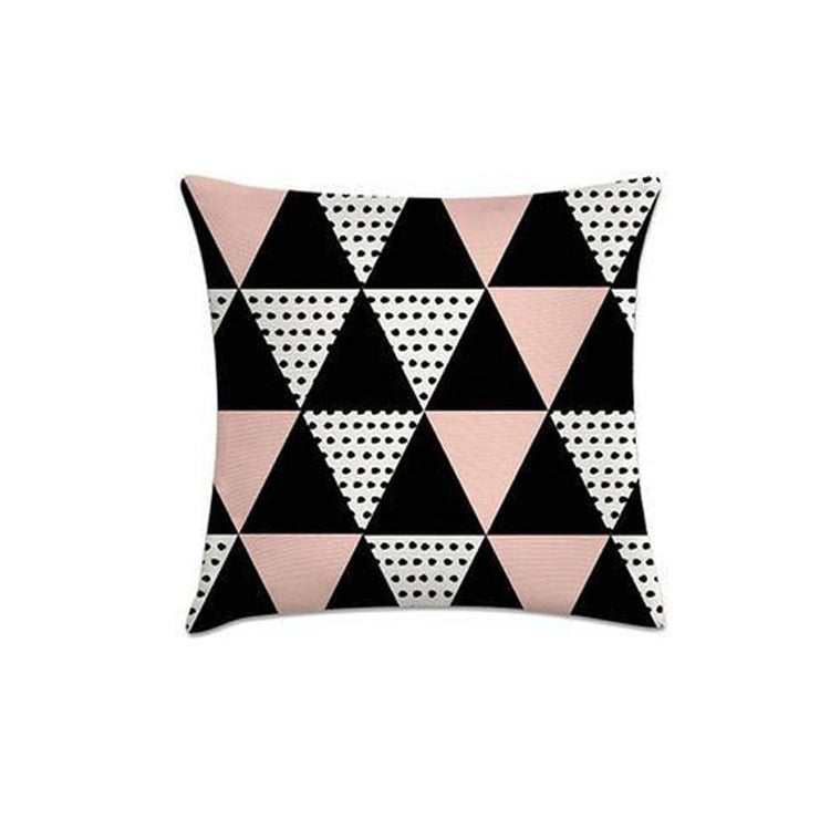 Cushion cover with rows of pink, black, white and dotted triangles.