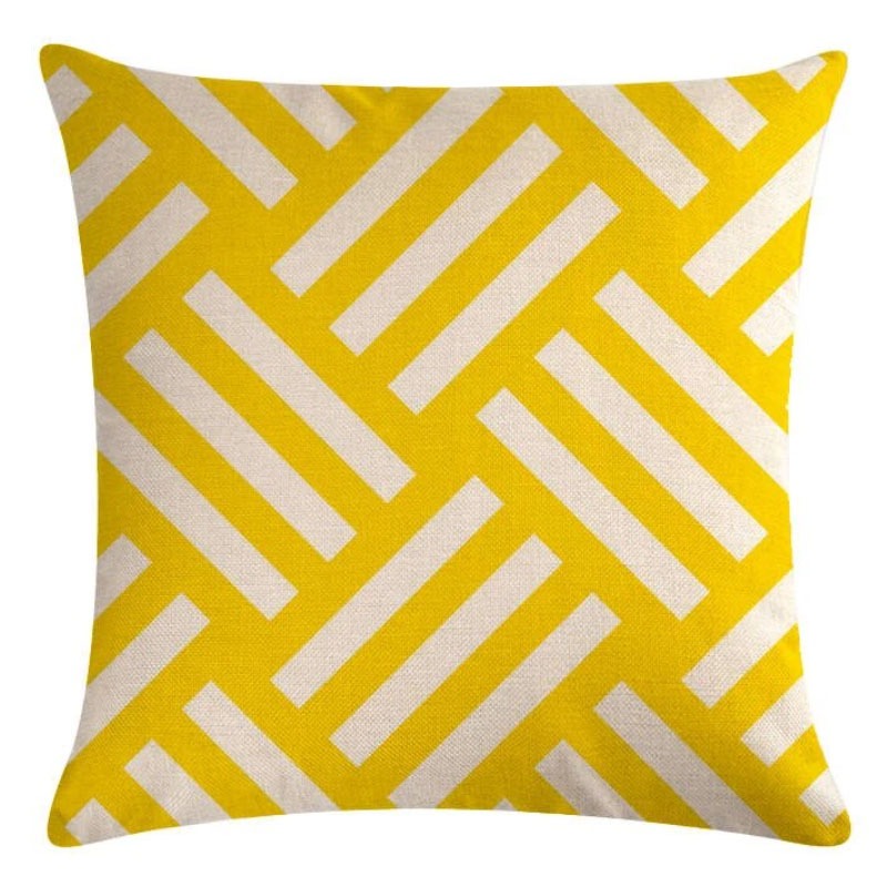 Yellow cushion cover with interlocking white diagonal bars.