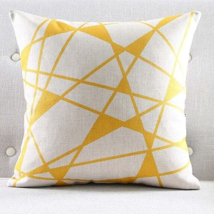 White cushion cover with fine yellow intersecting lines and yellow triangular shapes.