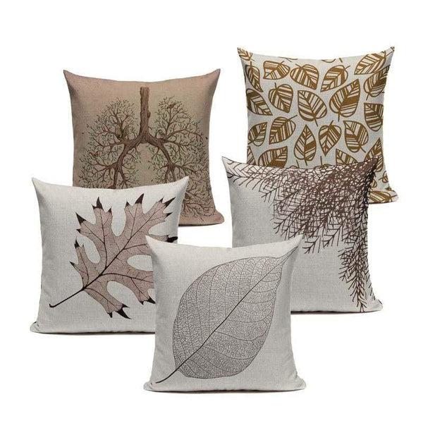 Five neutral cushion covers with leaf silhouettes and delicate botanical patterns.