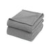 Folded grey waffle-weave cotton thermal blanket.
