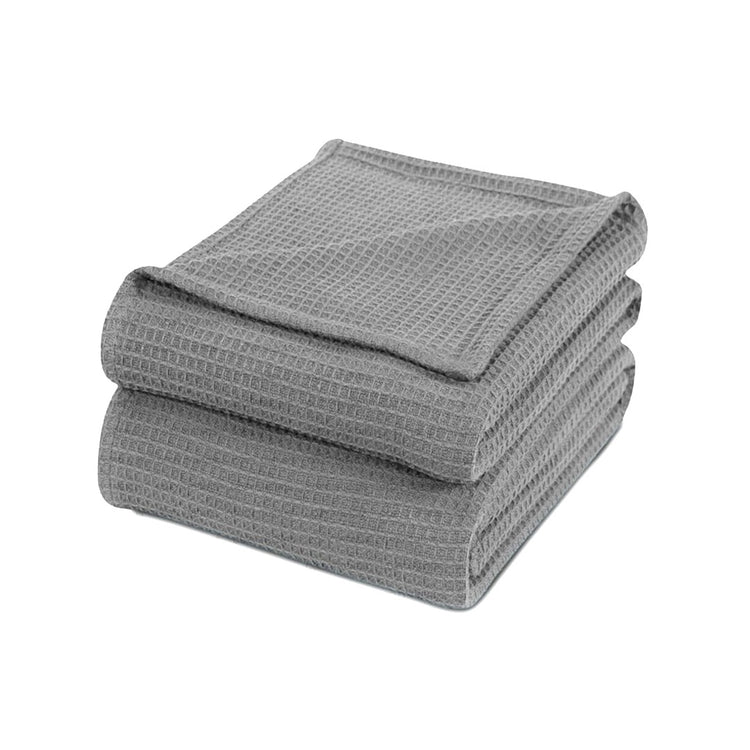 Folded grey waffle-weave cotton thermal blanket.