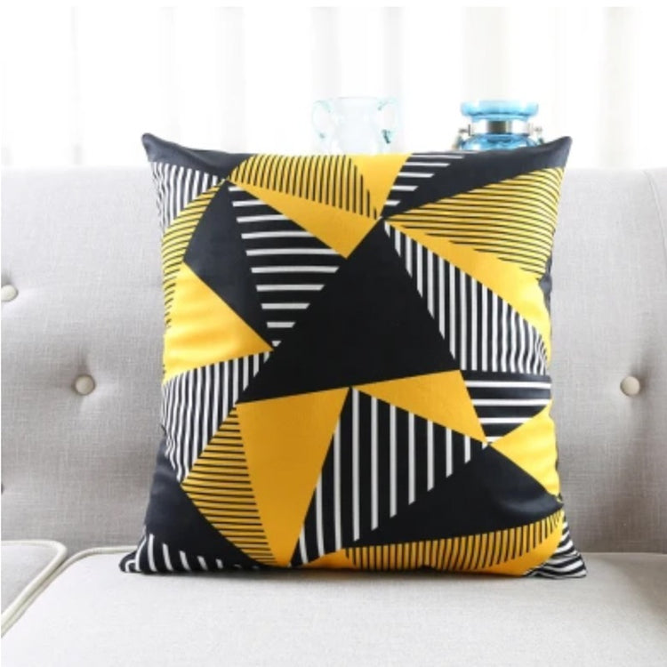 Cushion cover with large black and yellow triangles and fine striped details.