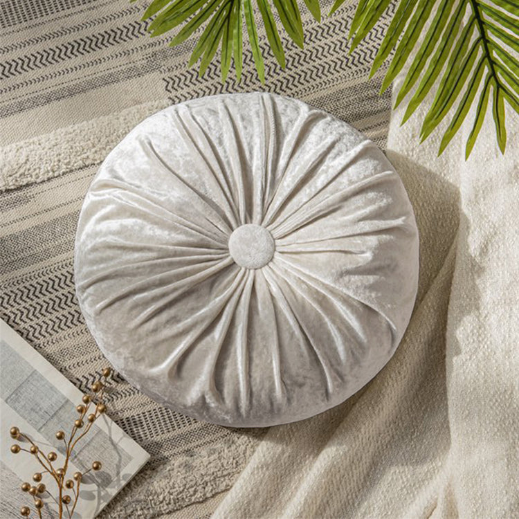Round silver grey cushion with radial pleats and a covered centre button.