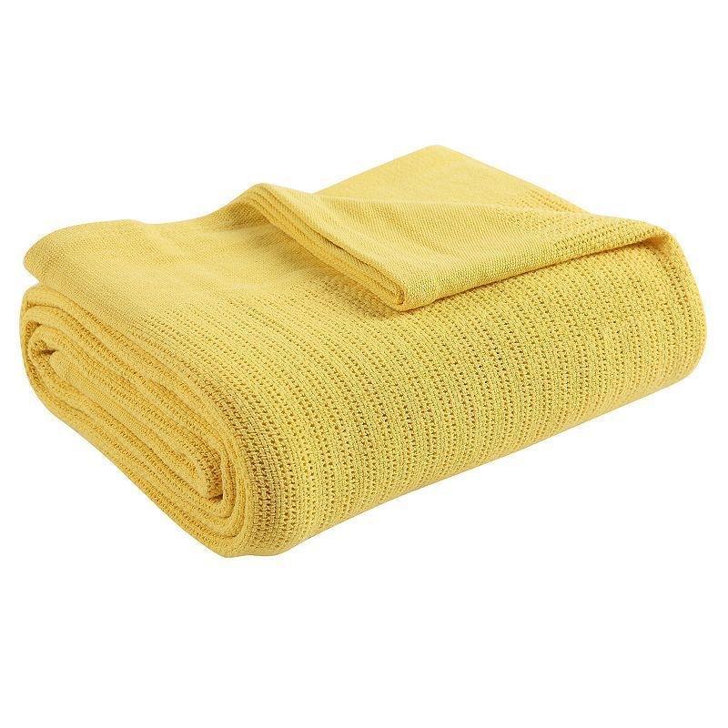 Folded yellow ribbed cotton thermal blanket.