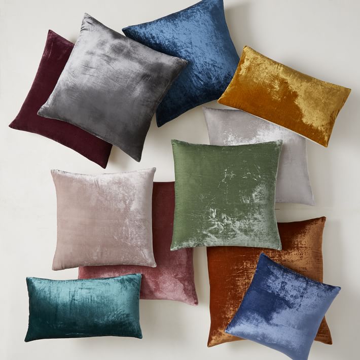 Assorted plain cushion covers in jewel and neutral colours with a soft textured finish.
