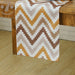 Brown, beige and white chevron table runner.
