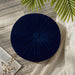Round navy cushion with radial pleats and a covered centre button.
